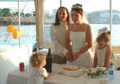 Suzanne and Melville cut their wedding cake in Cyprus.