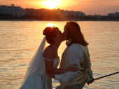 Suzanne and Melville sunset wedding kiss.