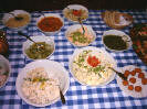 Estonian Buffet dishes including green tomatoes in honey, cheeseballs, potato salad