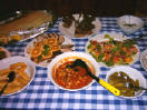 Meaty goulash soup, potatoes, advocado and orange salad