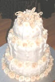 Wedding cake dream in Cyprus - Dark and white chocolate mudcakes with white ganache. Covered with vanilla fondant and 150 handmade gumpaste roses. Prices from C£300 - fruitcake from C£ 350 CYP