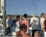 Guests mingle on a yacht at a wedding reception in Cyprus